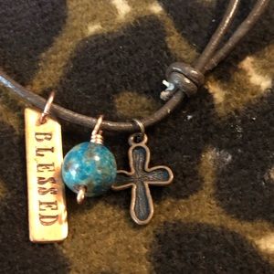 2 braclets one price one has a cross & other blessed & sea horse